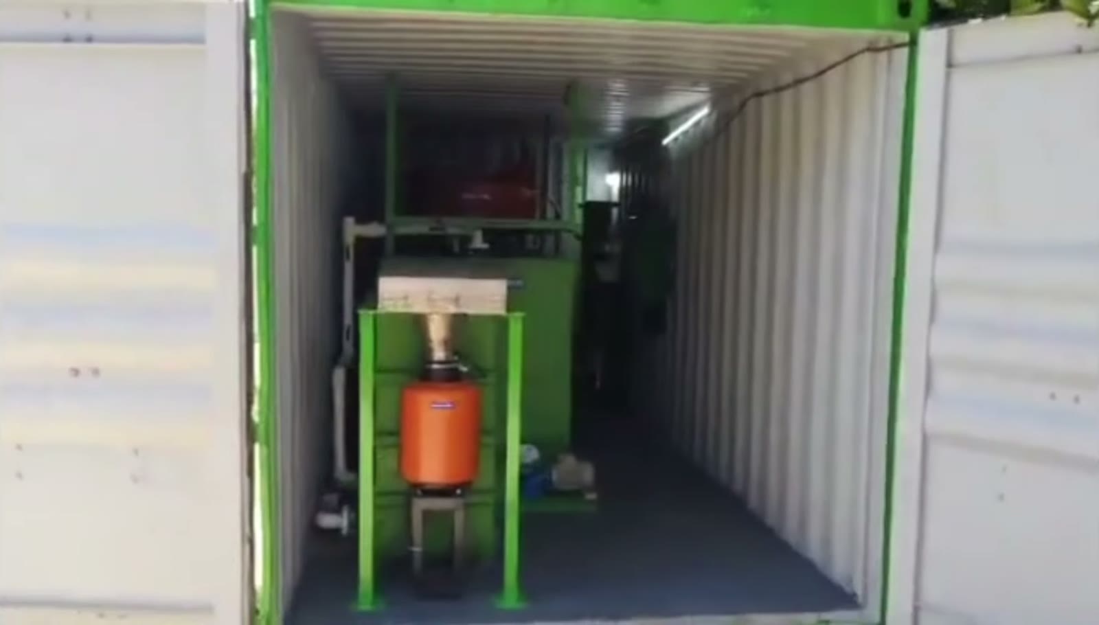 Open container showing the complete 100 kg/day biogas plant inside